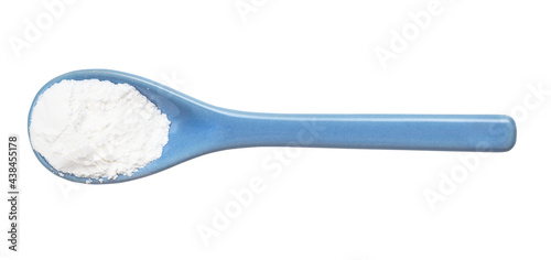 baking powder in ceramic spoon isolated