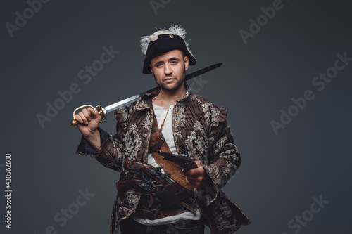 Medieval corsair pirate with saber and pistol