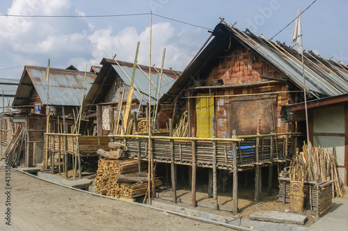 View of traditional wood and bamboo Apatani houses in tribal village on the Ziro plateau, Arunachal Pradesh, India