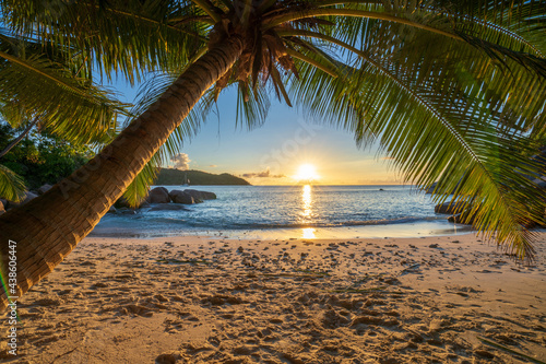 sunset at tropical beach anse lazio on praslin on the seychelles