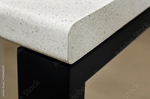 Fragment of a plastic countertop with an edge for the kitchen.