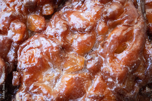 Macro close up of texture of an apple fritter pastry for breakfast at the donut shop