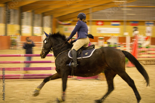2019.11.23 Tortona, Equestrian Center horse and jockey competing during a competition indoors in the Equestrian Center