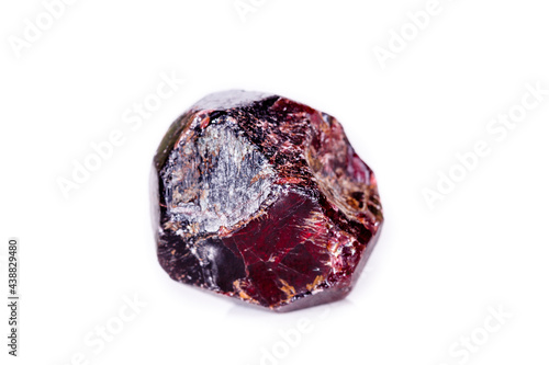 Macro of a mineral garnet stone on a white background