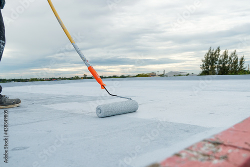 Hand painted gray flooring with paint rollers for waterproof, reinforcing net,Repairing waterproofing deck flooring. 