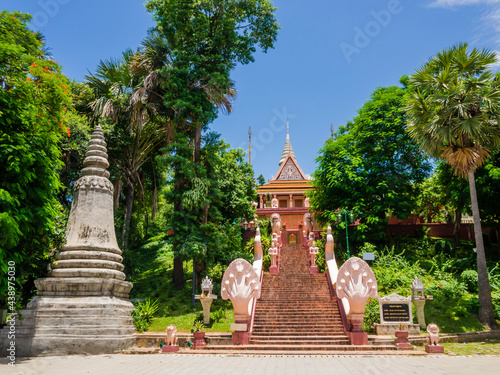 Stunning view of the main stairway with multi-headed snakes, leading to the Wat Phnom Pagoda, Phnom Penh, Cambodia 