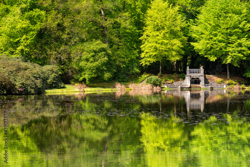 Lake with artificial waterfall in royal park Kroondomein