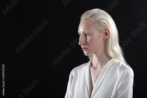 Close up profile portrait of caucasian albino blonde woman.