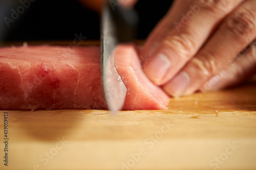 Cutting fresh tuna with a sashimi knife