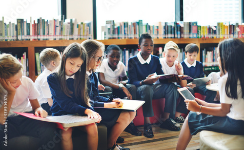 Diverse students wearing uniforms in school