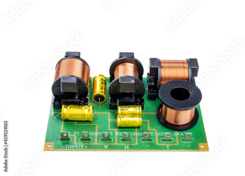 Audio frequency separation electronics for speakers, three-way crossover network, circuit board, clipping path isolated on white background.