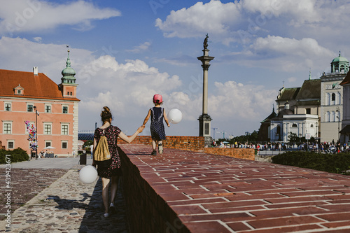 mother and daughter, walk through the old town, Warsaw