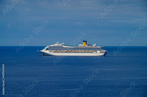 Costa cruiseships or cruise ship liners Pacifica, Fortuna and Favolosa anchored at sea offshore of Civitavecchia, Rome in Italy on sunny summer day with blue sky due to Corona Pandemic Pause