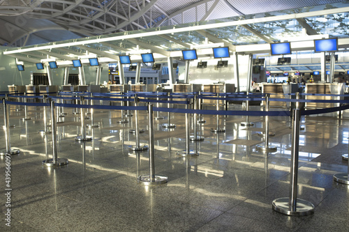 Coronavirus outbreak, empty check-in desks at the airport terminal due to pandemic of coronavirus an