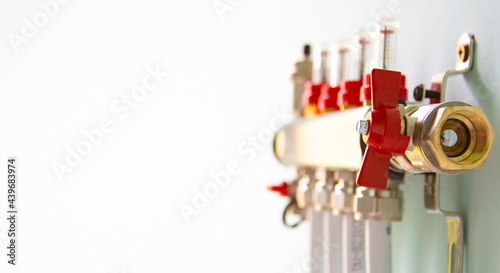 underfloor heating manifold with valves and piping. Selective focus. Place for text