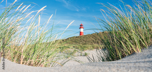 Dune beach and lighthouse near the North Sea coast on Sylt, Schleswig-Holstein, Germany