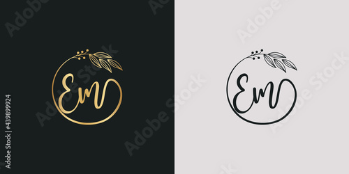 luxury golden signature letter E and m isolated circle with leaves ahead. vector monogram for cosmetic, restaurant, boutique, hotel , nature logo concept vector