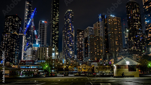 Low angle shot of the skyscrapers and modern buildings captured at night in Melbourne, Australia