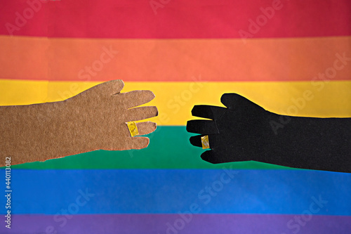 Handshake over flag between an african mixed couple