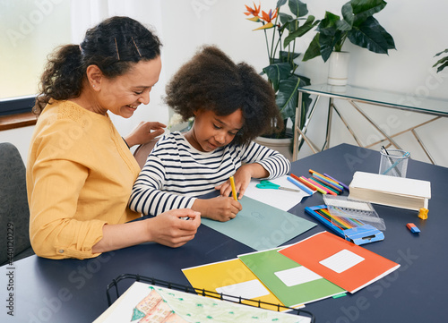 African American girl with autistic disorder with child's psychologist while psychological treatments for kid