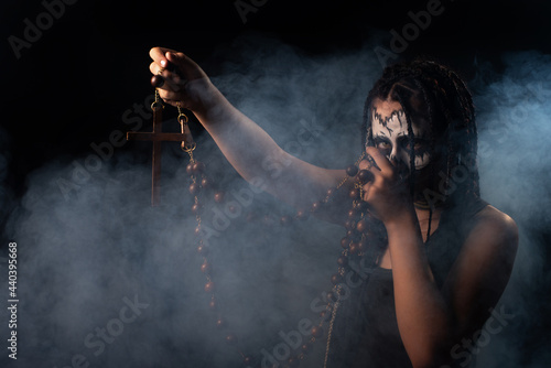 Voodoo queen, portrait of a supernatural entity Voodoo queen, artistic makeup, black background, Low Key portrait, selective focus.