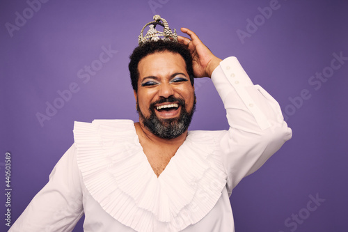 Portrait of a drag queen smiling with crown