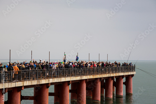 A large crowd of football fans on the pier by the sea, Sochi, Russia April 20, 2021