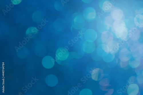 abstract blue bokeh glitter sparkle background.