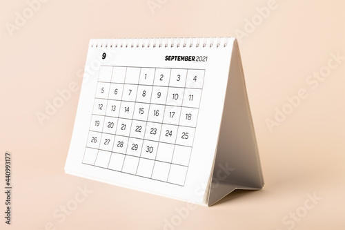 Flip calendar with page of September on color background