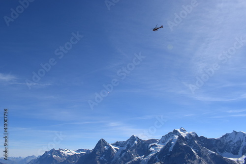Helicopter over swiss alps