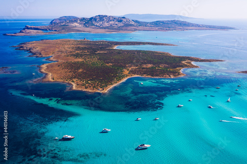 View from above, stunning aerial view of the Isola Piana island and the Asinara island bathed by a beautiful turquoise clear water. Stintino, Sardinia, Italy.