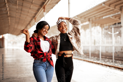 Portrait of a happy smiling female friends. Women laughing and having fun outdoors.