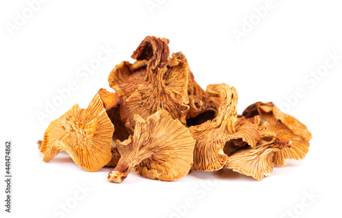 Dried chanterelle mushrooms, isolated on white background. Dried forest chanterelle mushrooms. Cantharellus cibarius. Close up.