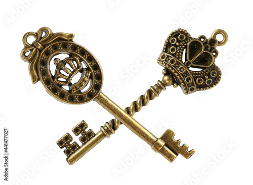 old brass key against a white background