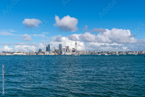 Auckland city skyline beyond Stanley Bay pier and harbour