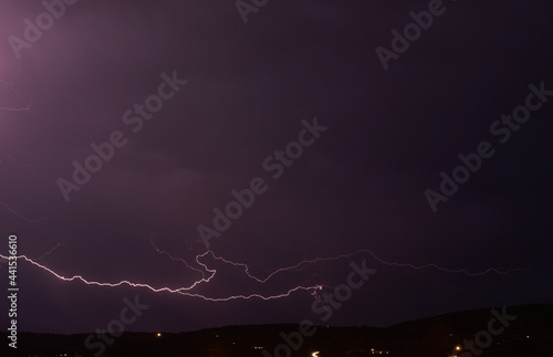 Lightning storm in the dark cloud sky illuminated by the glare of lightning
