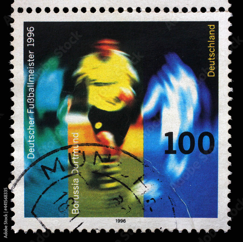 A stamp printed in Germany shows Borussia Dortmund football player, Borussia Dortmund's victory in German Football Championship 1996, circa 1996