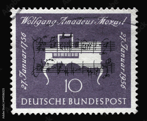 Stamp printed in Germany, shows note handwriting of Mozart and clavichord and was brought out on the occasion of the 200th birthday of the composer Wolfgang Amadeus Mozart, circa 1956