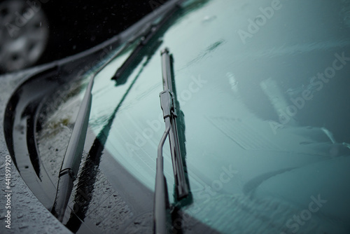 Car windshield wiper in the rain.