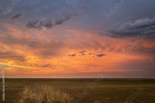 spectacular sunset sky over a green prairie - Pawnee National Grassland in Colorado, aerial view of late spring or early summer scenery