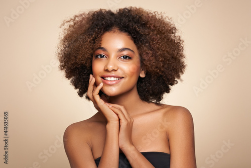 Beauty portrait of African American girl with afro hair. Beautiful black woman. Cosmetics, makeup and fashion