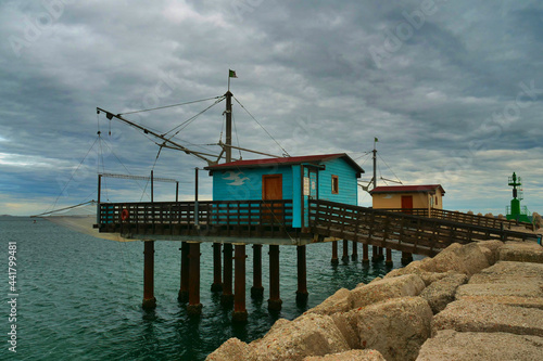 Winter sea with view of traditional italian wooden fishing houses, Fano, Italy.