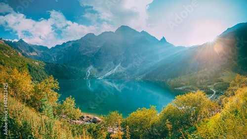 Tatra National Park, Poland. Famous Mountains Lake Morskie Oko Or Sea Eye Lake In Summer Evening. Beautiful Sunset Sun Sunshine Sunrays Above Tatras Lake Landscape