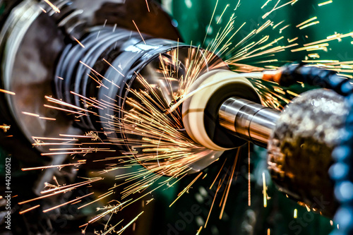 High-precision metal processing on a CNC cylindrical grinding machine.