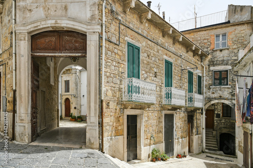 Bovino, Italy, 06/23/2021. A narrow street among the old houses of a medieval town with a Mediterranean style in the Puglia region.