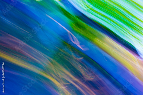 Abstract bright blue-yellow-green acid background.