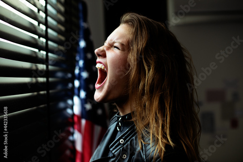 Stressed girl screaming in her room