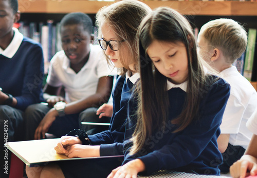 Diverse students wearing uniforms in school