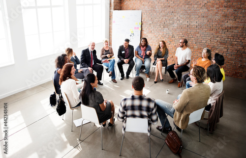 People in a discussion seated in a circle