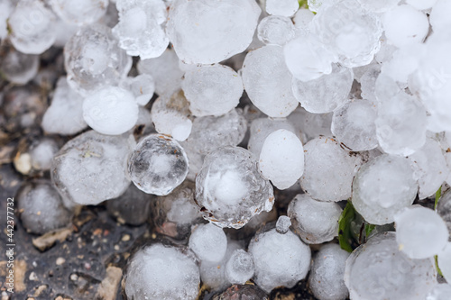 A pile of large hail on the ground